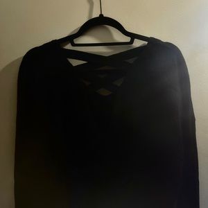 Cropped V-neck black sweater.